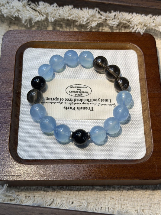 Crystal colour and bead design reference for Blue & Onyx custom pet necklace; photo shows a bracelet, not a finished pet necklace